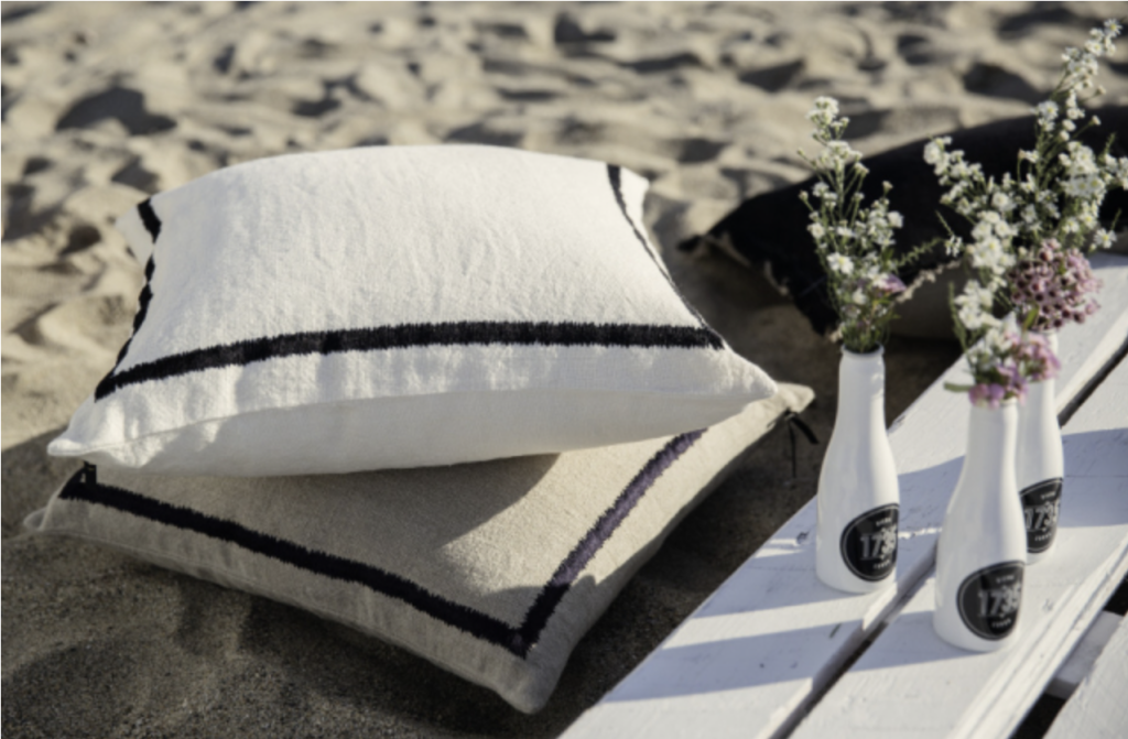 KEA linen cushions styled on a beach setting