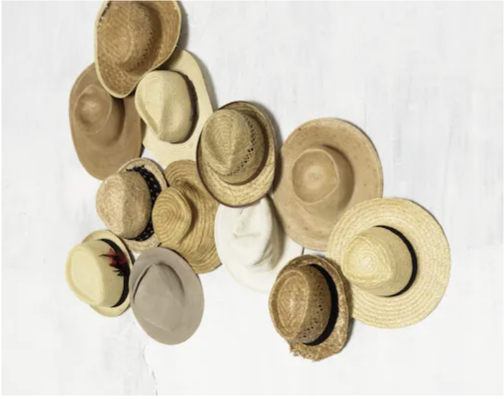 Interior styling featuring a summer hats display.