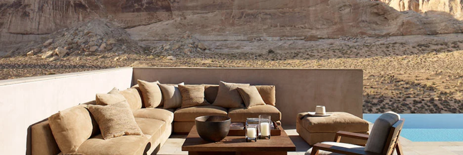 Summer interior styling inspiration showing relaxed indoor–outdoor seating, natural textures and warm neutral tones