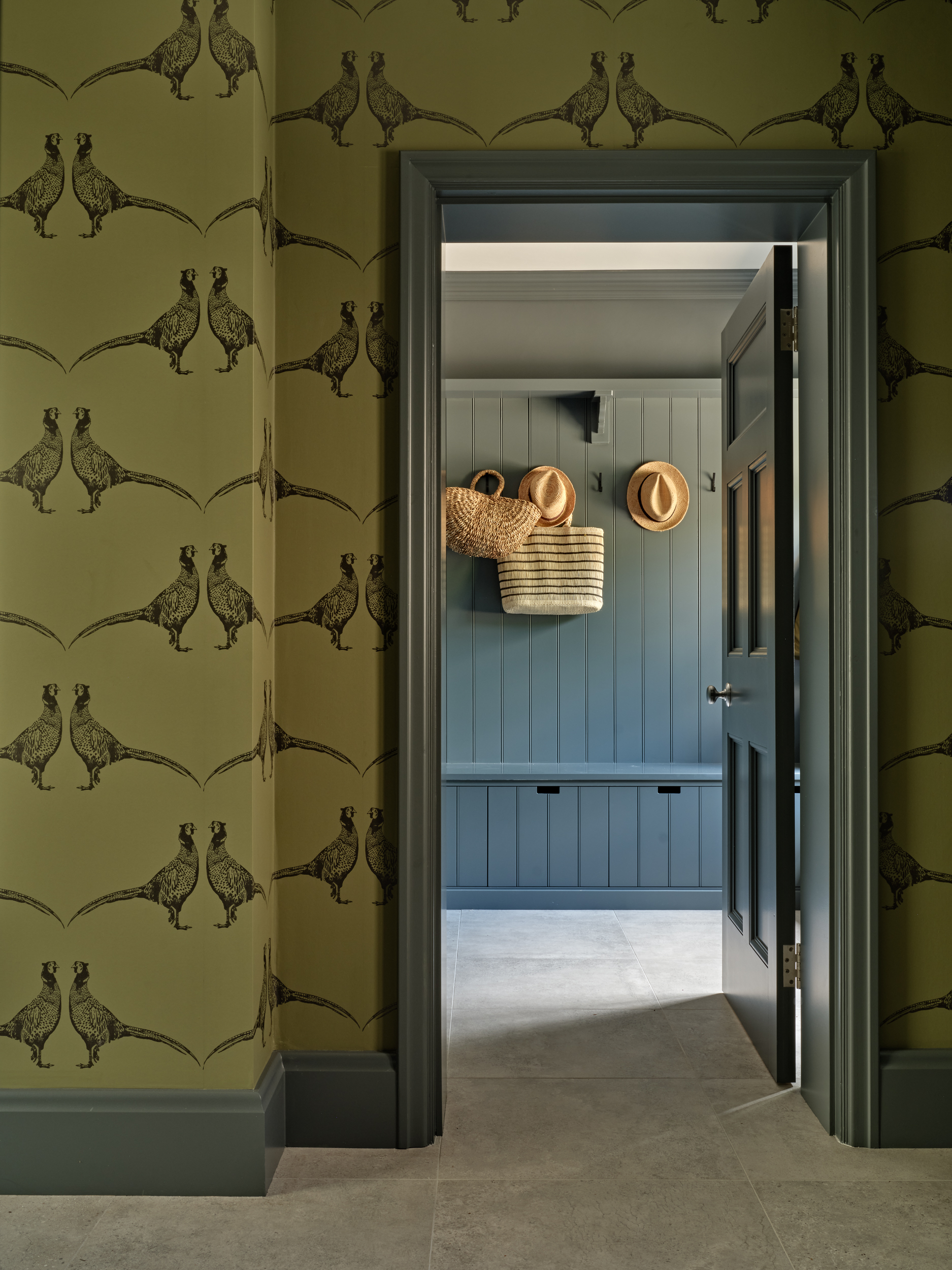 Boot room design in a Cotswold home with bespoke joinery and stone flooring
