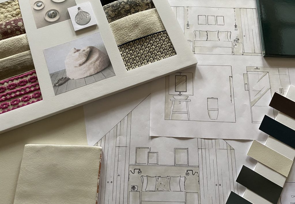 Hand-drawn interior sketches and material samples laid out together, illustrating a design process that moves beyond the screen to explore ideas by hand.